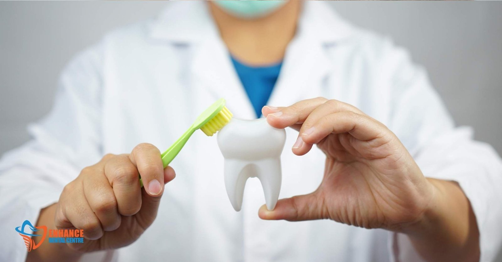 A dentist demonstrating proper brushing technique