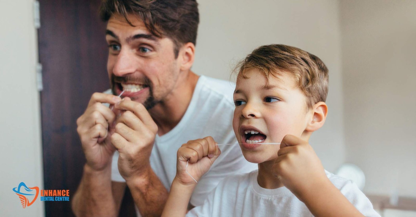 Parent helping child floss their teeth