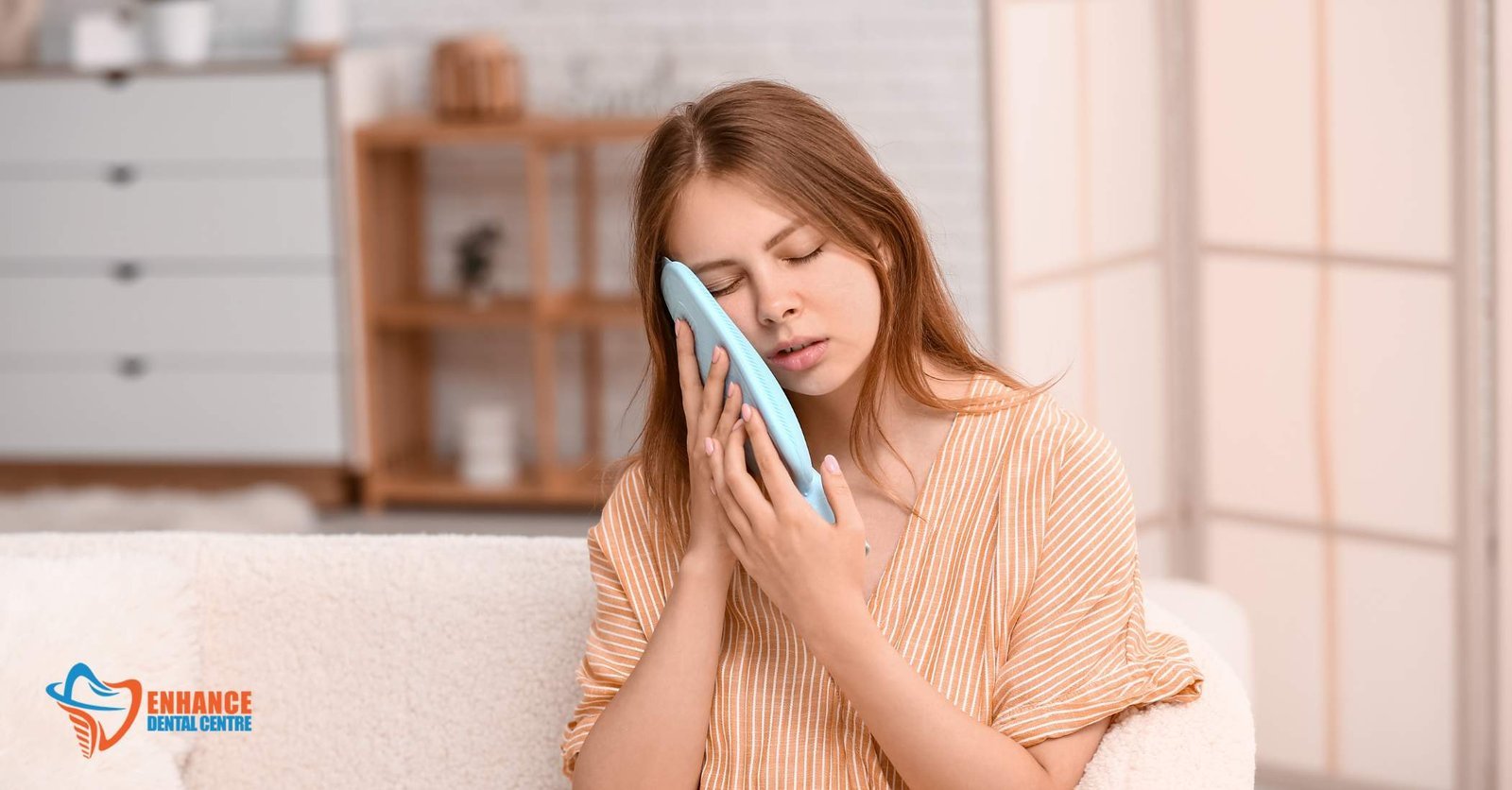  a person applying a cold compress to their cheek