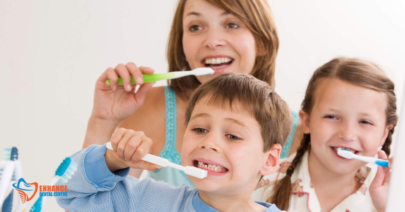 Parent cleaning baby’s gums with a soft cloth