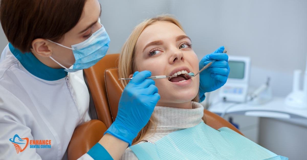 A dentist using a laser tool to reshape a patient’s gum line