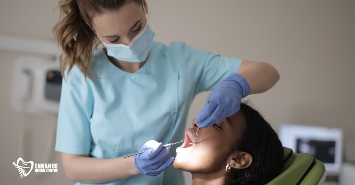 A dentist applying tooth-colored