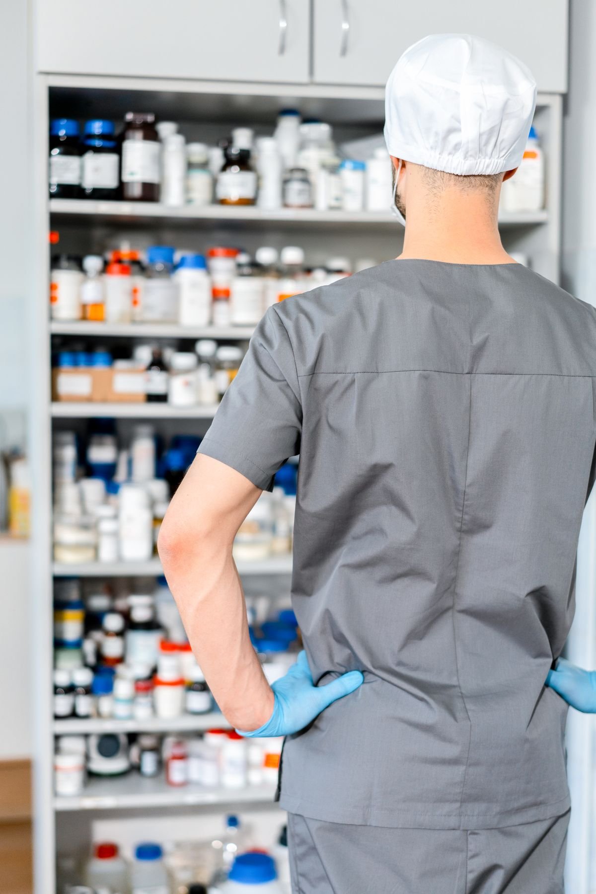 Pharmacist preparing medication for post-extraction care