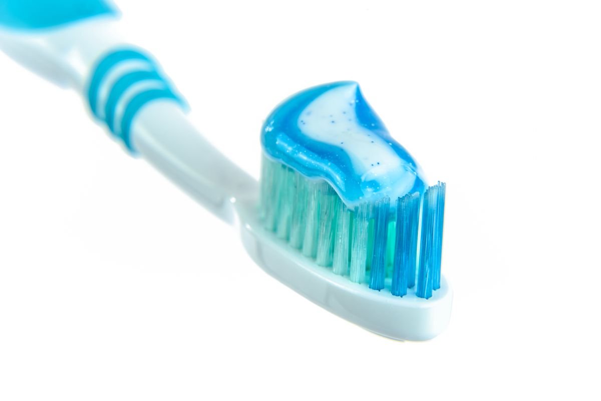 Detailed close-up of a toothbrush with toothpaste