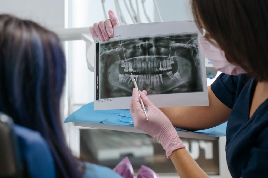 Dentist showing a dental X-ray image to a patient
