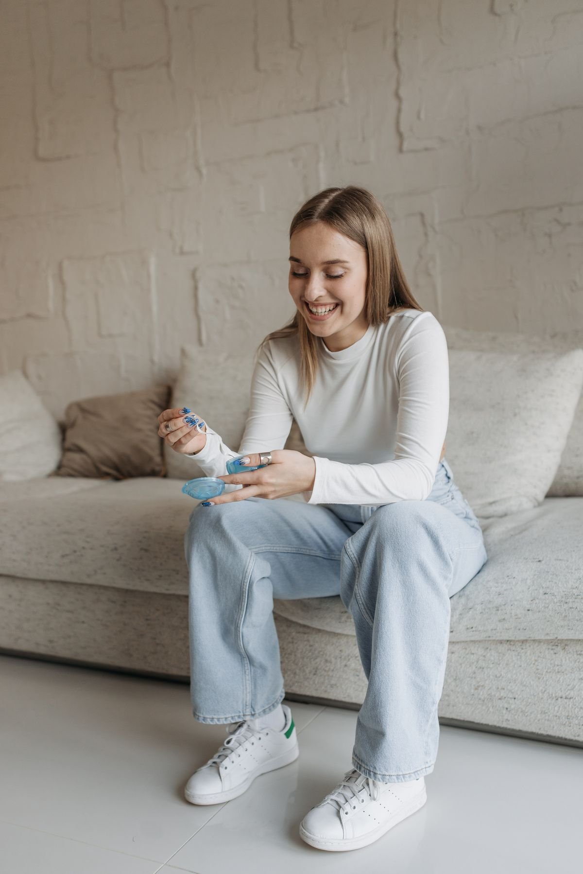 Happy woman sitting comfortably
