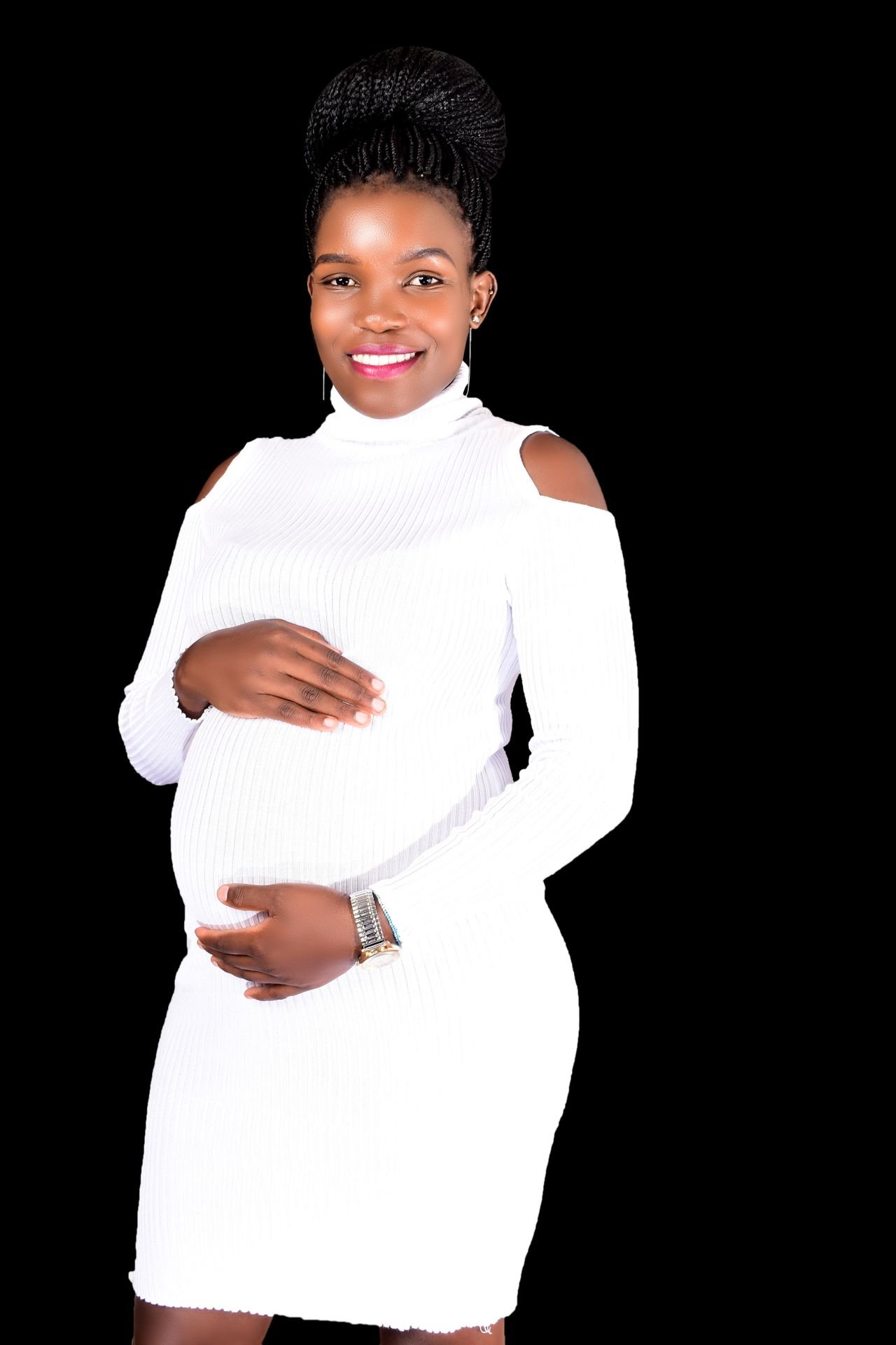Pregnant woman in a white dress, planning safe dental care during pregnancy