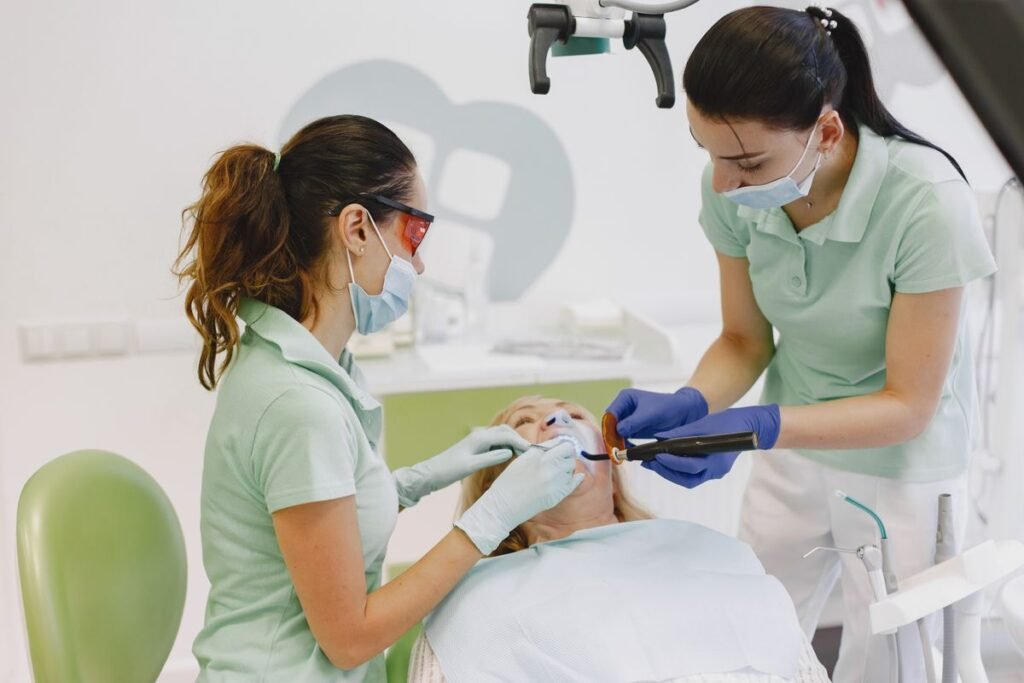 Dentists placing a dental filling at a Kitsilano dental clinic