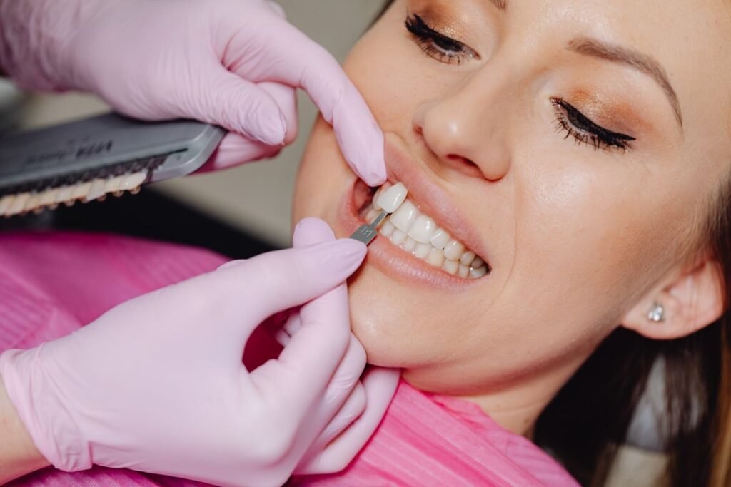 Dental veneer being fitted to correct crooked teeth